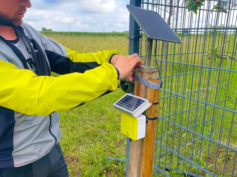 A 3Bee technician installs a Spectrum sensor and a camera trap on a food supply-chain site: field data that feeds an ESRS E4 disclosure